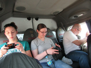During the ride to Ilo, WCC students check their pictures and snap a few more out the van's windows.