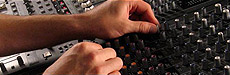 An image of an audio mixing board