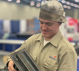 WCC student Evan Pasternak shows off some of his work completed during the SkillsUSA National Leadership and Skills Conference in Louisville, Kentucky.