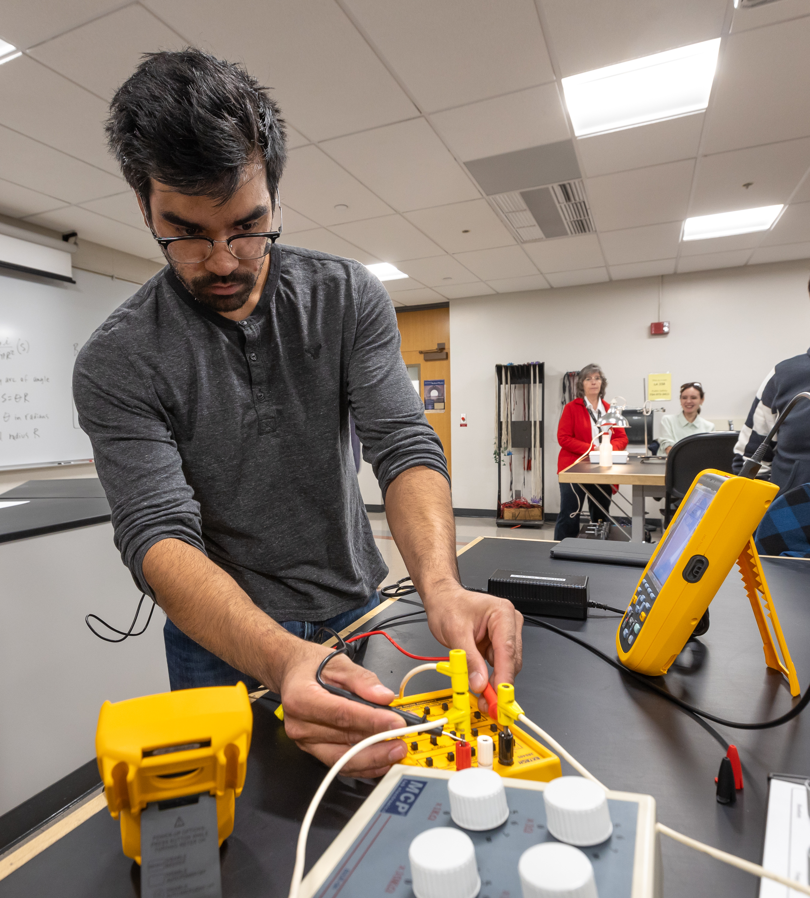 Student using Fluke lab tools