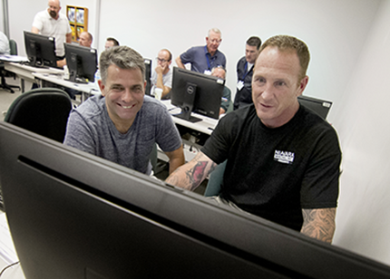 Operative Plasterers’ and Cement Masons’ International Association (OPCMIA) members advance their skills inside a Washtenaw Community College computer lab during the inaugural year of their Instructor Training Program in 2018.