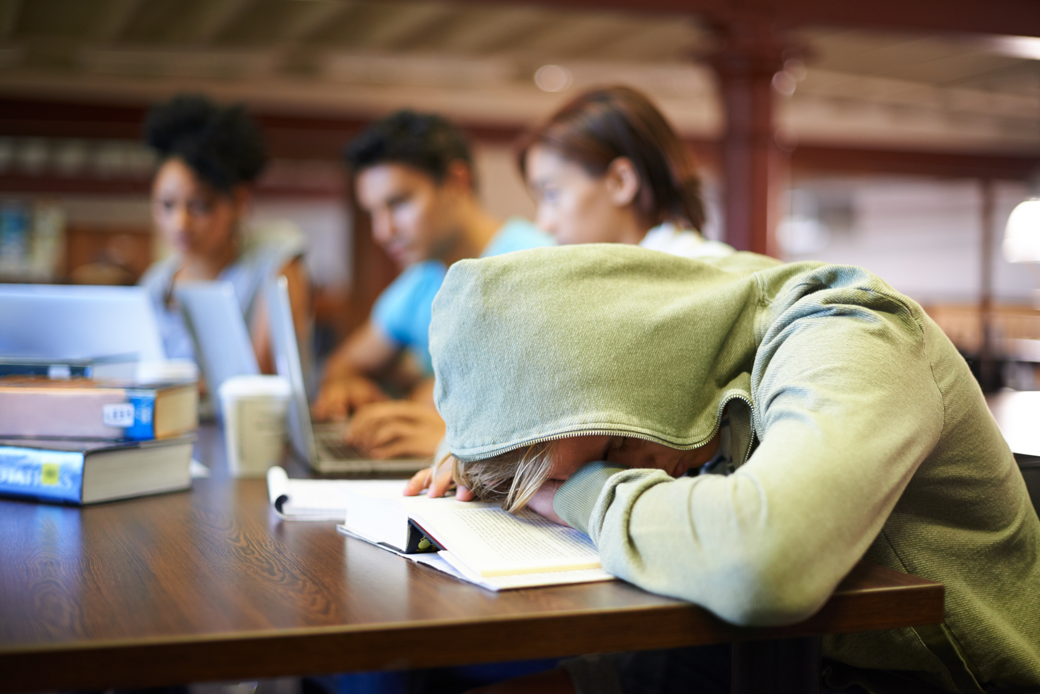 Student Sleeping in Library