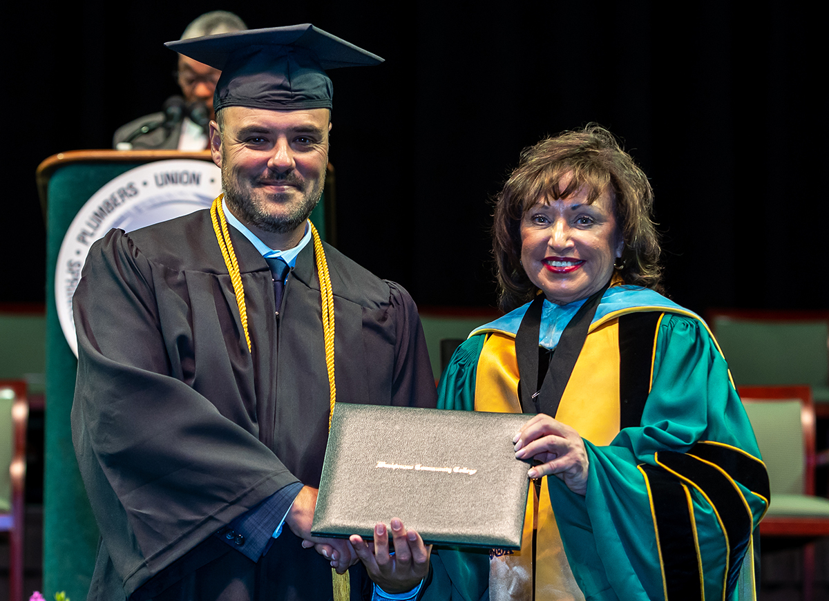 UA member receives diploma