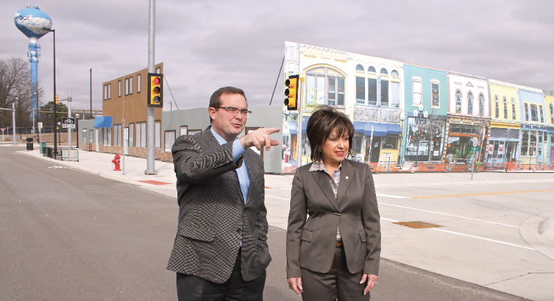 In this 2016 file photo, Dr. James R. Sayer, director of the University of Michigan Transportation Research Institute, shows WCC President Dr. Rose B. Bellanca around the streets of Mcity, a 32-acre simulated urban environment used to test connected and autonomous vehicle technology. | Photo by Lynn Monson