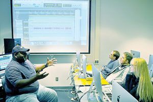 Bonnie Billups, WCC audio instructor and Avid Pro Tools trainer, talks with students in the “MUS 175: Audio Recording Technology (Avid Pro Tools Certification(” course. (Photo by Jonas Berzanskis)