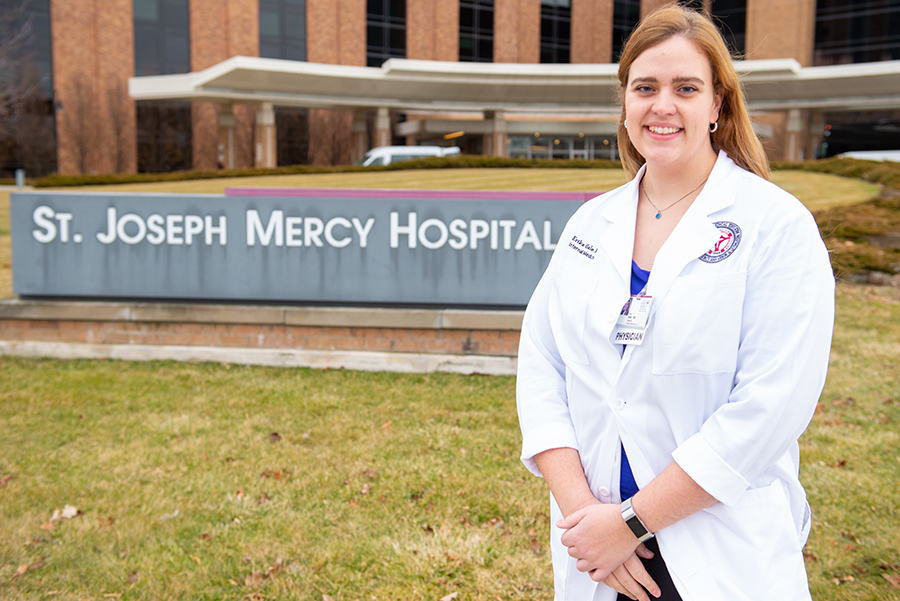 Dr. Erika Gale next to a St. Joseph Mercy Hospital sign