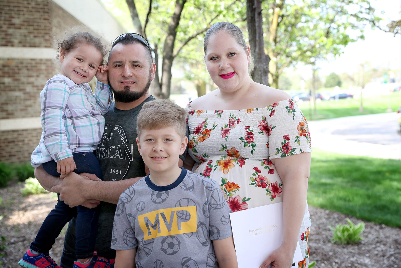 WCC graduate Mia Guzman (right) with her husband Pedro, son Christian and daughter Brielle after the Spring Honors Convocation. (Photo by Kelly Gampel)