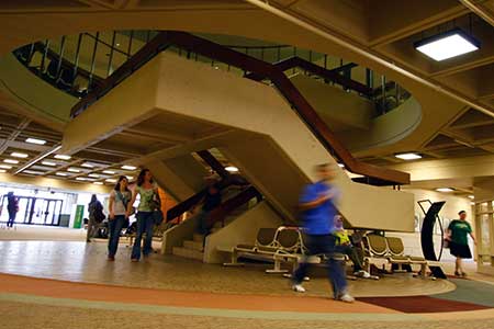 students walking through student center lobby